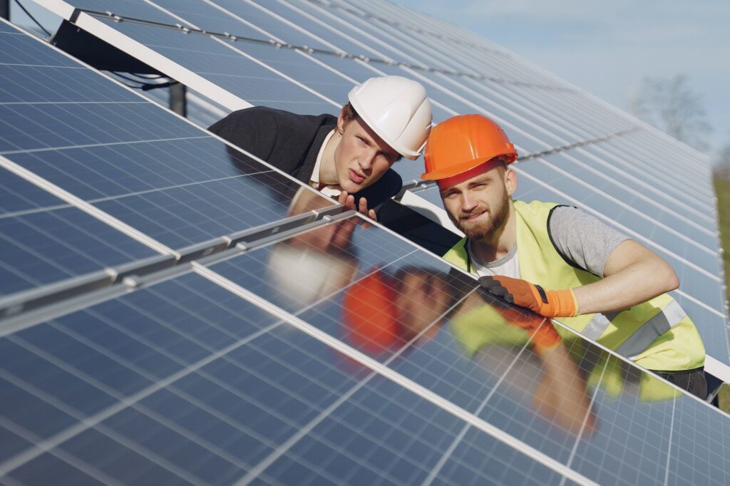 Foreman and businessman at solar energy station